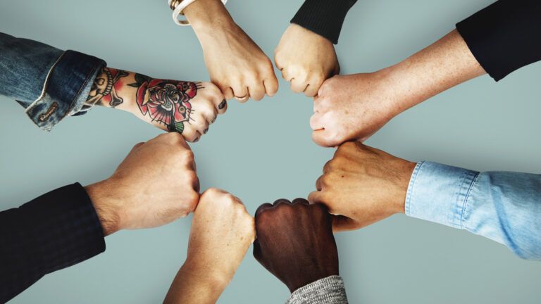 Group,Of,People,Fist,Bump,Assemble,Together